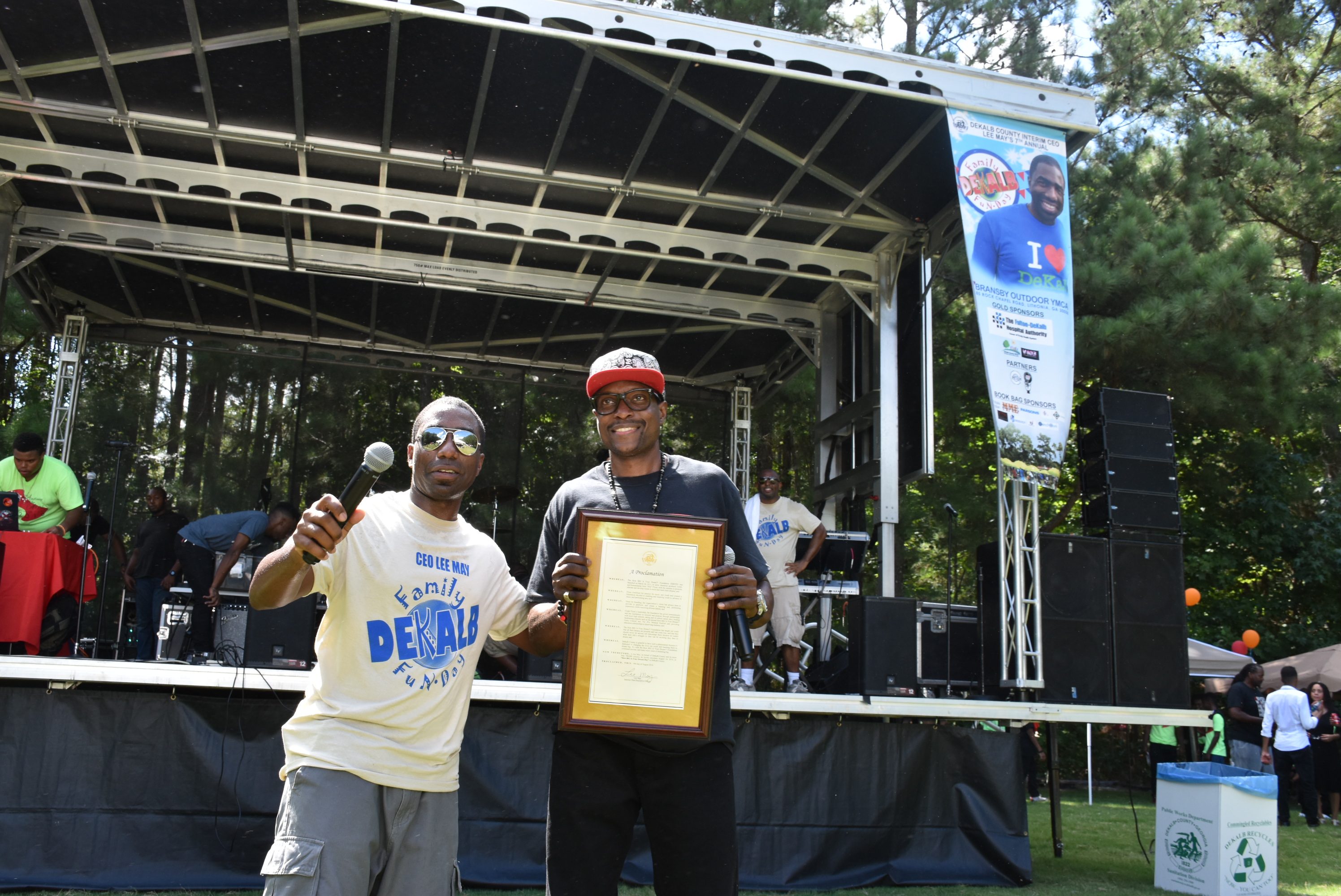 DeKalb Interim CEO Lee May presents a proclamation to Jorel "JFly" Flynn, who partnered with May for the DeKalb Family Fun Day.