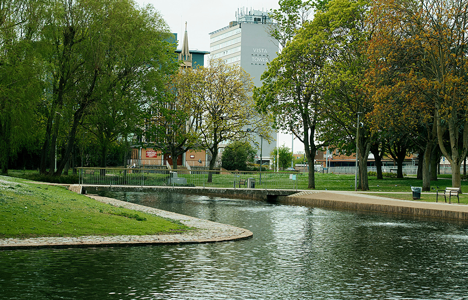 Building in distance with a park in front