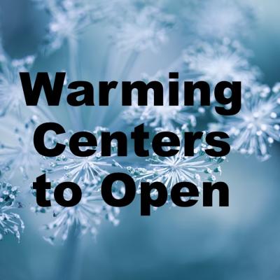 Text "Warming Centers to Open" over a close-up of frost-covered flowers on a blue background, conveying a cold, wintry atmosphere.