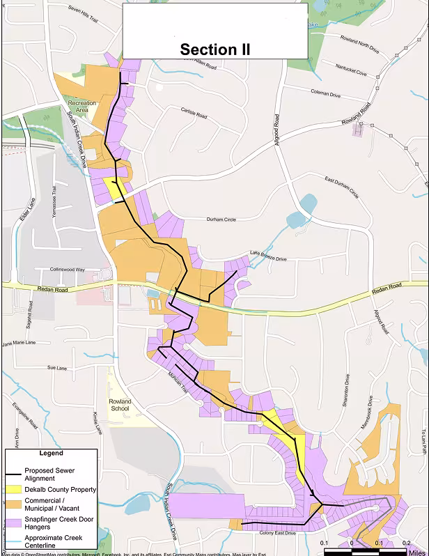 A DeKalb County map showing the Upper Snapfinger trunk sewer upsizing project Section two marked with a black line with other areas marked in yellow, orange, and purple.