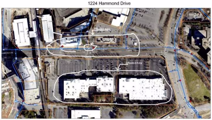 Aerial view of 1224 Hammond Drive shows large white-roofed buildings in a parking lot. Areas of interest are outlined, showing urban infrastructure.
