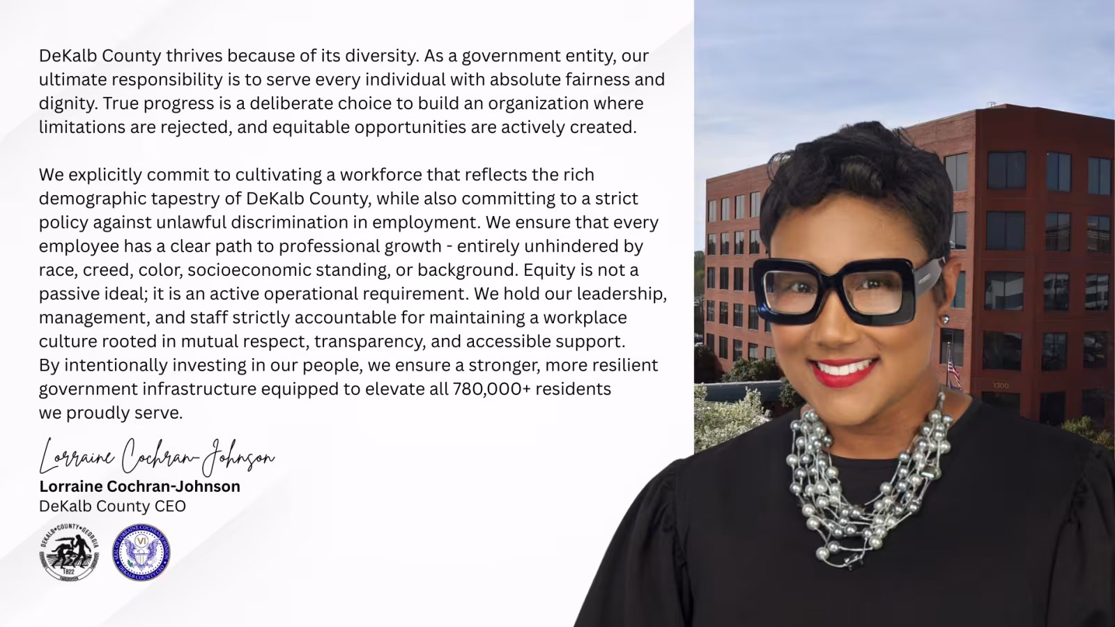 Image of DeKalb County CEO Lorraine Cochran-Johnson smiling in a black dress wearing black framed glasses with a silver pearl necklace with verbiage and has the Manuel J. Maloof building in the background