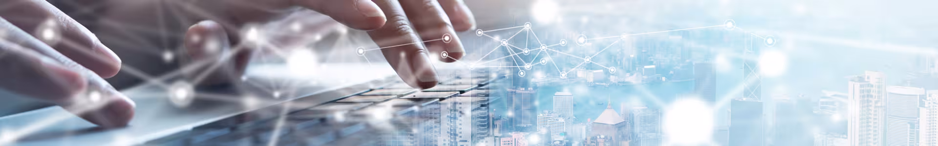 Futuristic style hue over a city landscape and a man typing on a keyboard on the left side of the image.